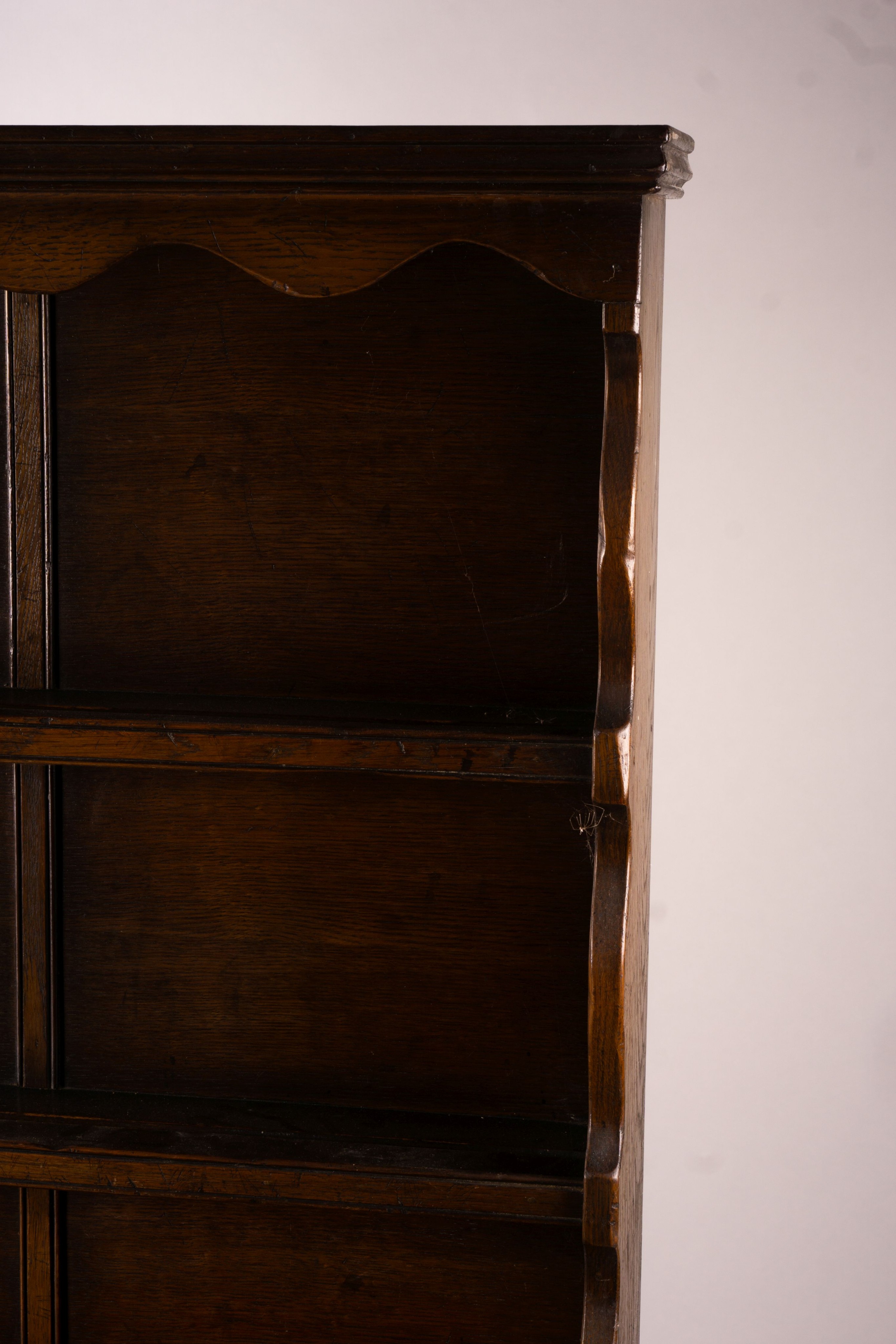 An 18th century style carved oak dresser, width 124cm, depth 46cm, height 175cm